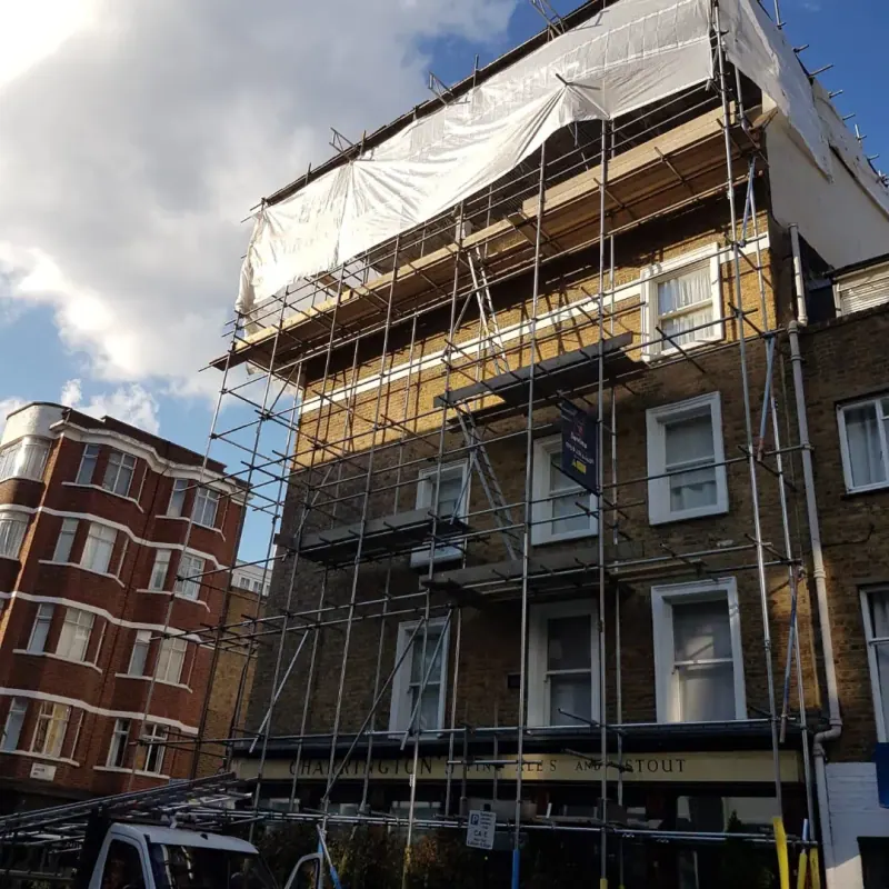 Deep-perspective view looking up terraced street scaffold under blue sky