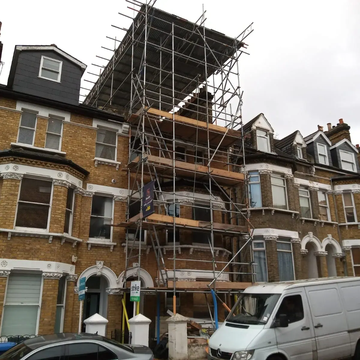 Full-height scaffold on a tall five-storey Victorian terrace in Muswell Hill